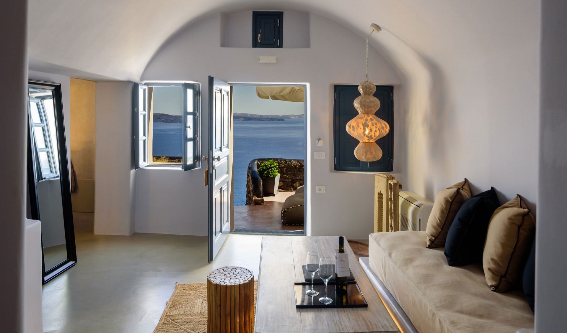 The lavish double bed offered from Nostos Apartments in Oia Santorini