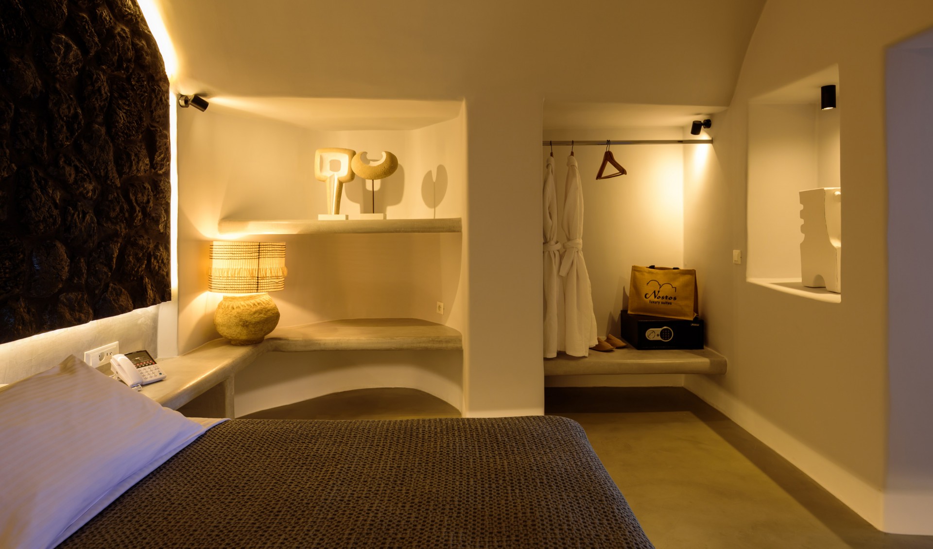 The lavish double bed offered from Nostos Apartments in Oia Santorini