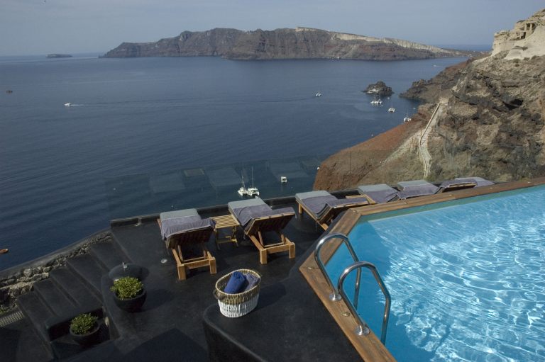 The breathtaking view from the pool of Nostos Apartments in Oia Santorini